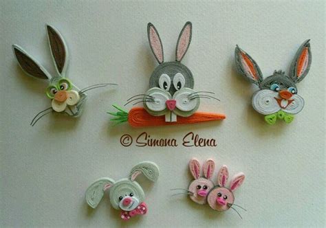 Four Different Bunny And Rabbit Hair Clips On A White Surface