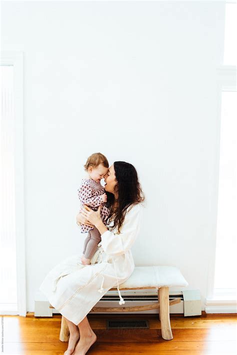Mom Holding Daughter By Stocksy Contributor Jennifer Brister Stocksy