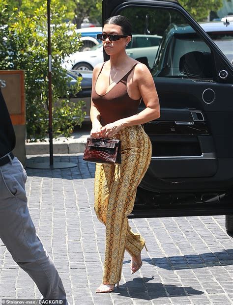 Kourtney Kardashian Flaunts Her Assets In Skin Tight Cleavage Baring