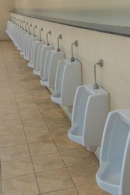 Premium Photo Urinals In Public Restroom