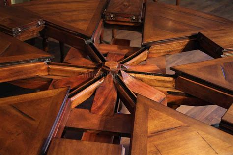 This stunning table with extension leaf provides plenty of space for family and friends to gather and has a classic design that is sure to add opulent elegance to your dining room. 54 70 Round Solid Walnut Round Dining Table with HIdden Leaves