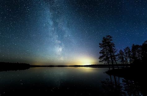 Jani Ylinampa Stars Reflecting In Lake Northern Lights Photography