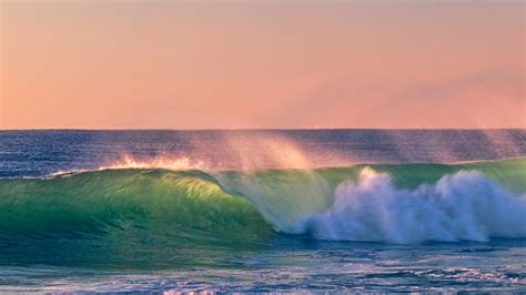 Colorfull Wave Crashing At Sunset Stock Photo Download Image Now Istock