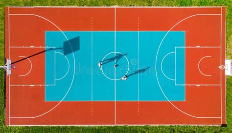 Basketball Player Long Shadows On Basketball Court Creative Visual