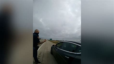tesla driver appeared to be sleeping behind the wheel authorities say so deputies pulled him