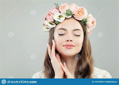 Spring Beauty Portrait Of Enjoying Model Woman With Flowers Stock Photo