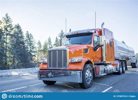 Big Rig Orange Classic American Semi Truck Transporting Liquid Cargo In