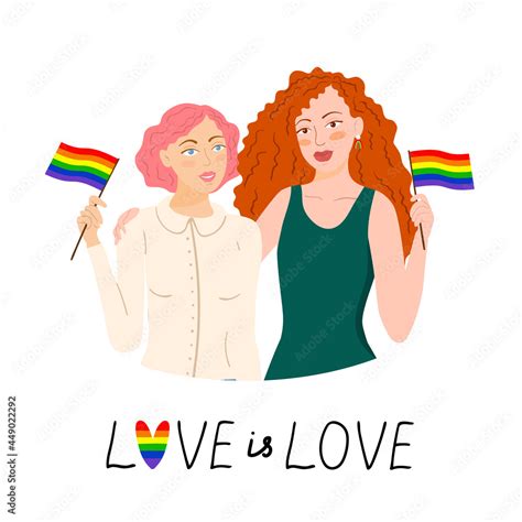 Two Lesbian Girls Are Holding Flags Of The Day Of The Gay Pride Parade Lgbt Women Hugging And