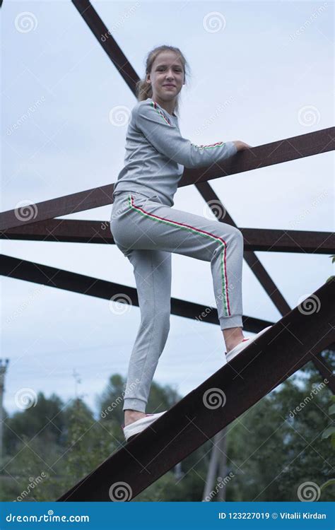 Girl Climbs On A Metal Construction Stock Image Image Of Bored