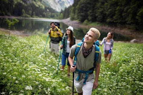 Smiling Friends Walking With Backpacks Adventure Travel Tourism