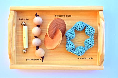 A few other toys come to mind immediately, toys inspired by the montessori grasping beads, ring on a ribbon and the bell on a ribbon. Montessori Newborn Toys - Wow Blog