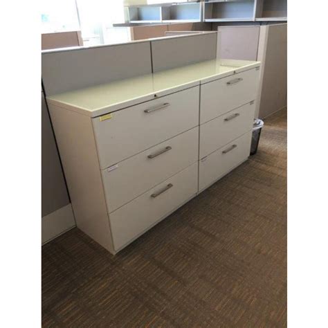 Spruce up the decor of your home or office areas with this white file cabinet crafted with engineered wood. Haworth White Lateral File Cabinet (36"W) (3 DR) | Haworth