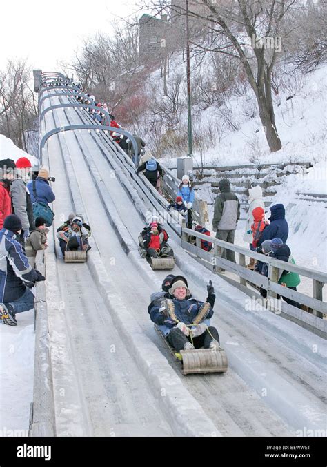 Sliding Down Ice Toboggan Run At Dufferin Terrace Boardwalk Below Chateau Frontenac During