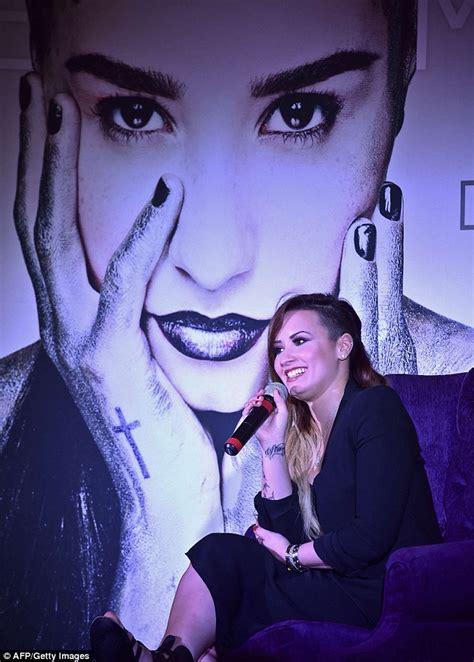 Demi Lovato Poses Under Giant Portrait Of Herself Ahead Of Mexican