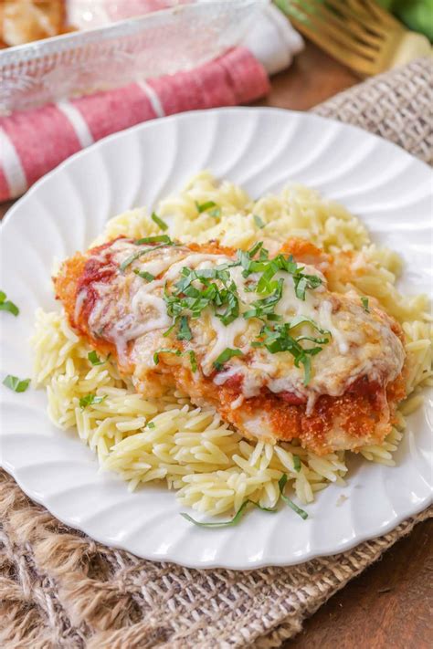 Crispy coated chicken, delicious tomato sauce, and plenty of melty cheese! EASY Baked Chicken Parmesan Recipe (+VIDEO) | Lil' Luna