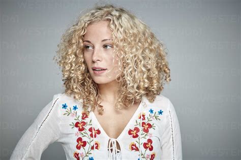 Portrait Of Blond Woman With Curly Hair Stock Photo