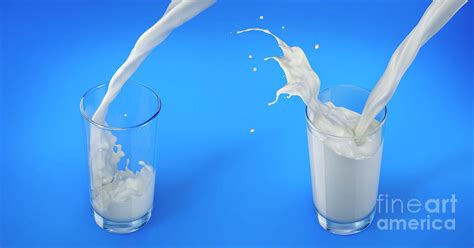 Pouring Milk Into Glasses With Splash Photograph By Leonello Calvetti