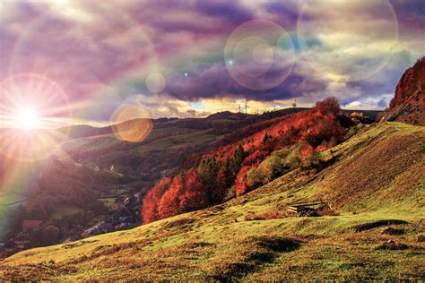 Free Light Beam Falls On Hillside With Autumn Forest In Mountain Stock