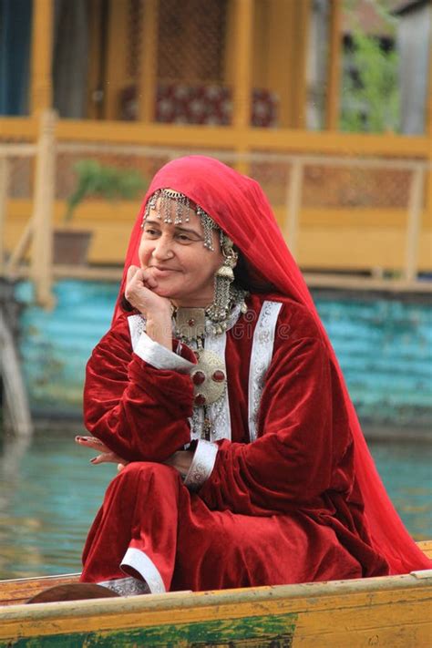 Kashmiri Woman In Traditional Red Dress And Ornaments Stock Photo