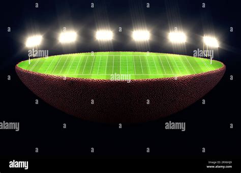 An American Football Ball Split In Half Revealing A Marked Green Grass