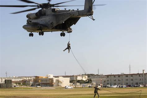 Marines Rappel Off A Ch 53e Super Stallion Helicopter At Camp Hansen