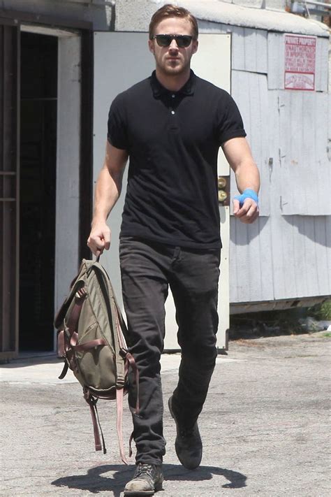 Ryan Gosling Wearing Black Polo Black Jeans Black Leather Casual Boots Olive Canvas Backpack