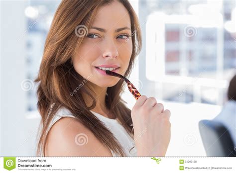 Attractive Woman Biting Her Glasses Stock Photo Image Of Cheerful