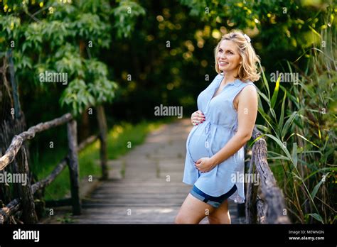 Beautiful Pregnant Woman In Nature Stock Photo Alamy