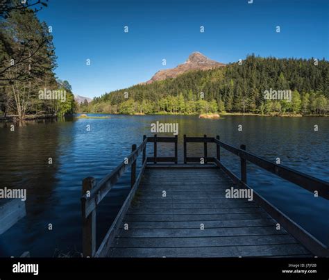 An Image Of The Glencoe Village Lochan On A Beautiful Spring Evening