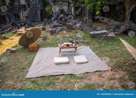 Picnic On Grass In Ancient Ruin Japanese Style Picnic With Umbrellas