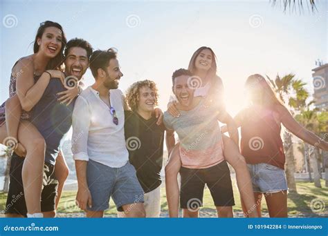 Group Of Young People Having Fun Together Outdoors Stock Photo Image
