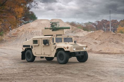 The M1167 Is An Expanded Capacity Tow Or Armament Carrier Hmmwv That