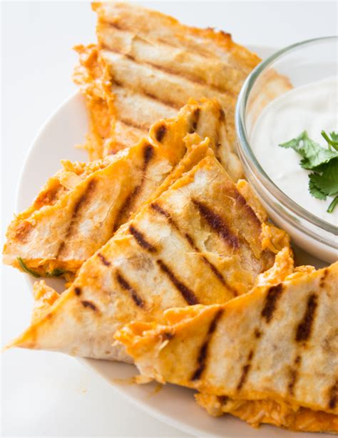 Simply tuck your favorite ingredients into a tortilla and pan fry until melted and crisp. Lightened up Buffalo Chicken Quesadillas | Gimme Delicious