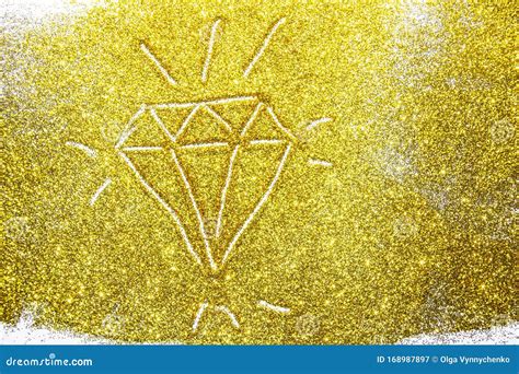 A Composition With A Diamond On Beautiful Gold Glitter Background And
