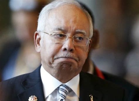 Najib Razak and Boris Johnson disagree on how to fight Covid-19