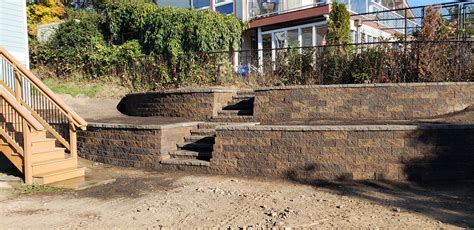 Like the plant stand made of cinder block, it brings a unique impression and blends with the surrounding environment. Large Concrete Block Wall $14-24K | Brookside Landscape Design