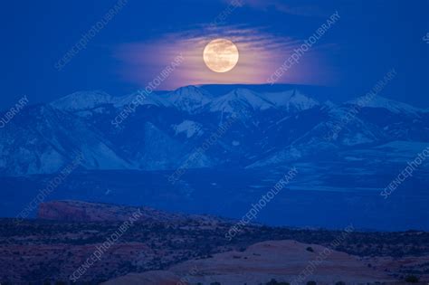 Full Moon Rising Over Snow Capped La Sal Mountains Utah Usa Stock