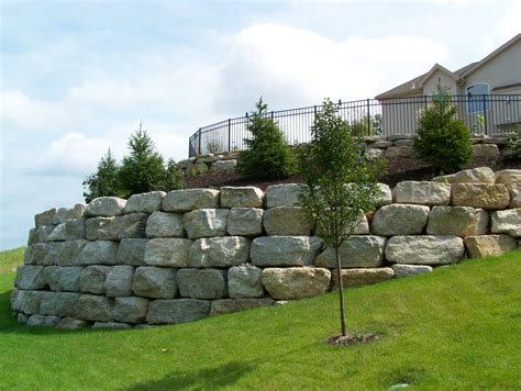 We'd love to create the optimum outdoor living space for you…a place to come home to…relax, unwind, and play. Boulder Retaining Walls - Landscaping St. Louis, Landscape ...