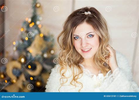 Beautiful Girl In White Dress Sitting Near A Beautiful Tree Stock Image