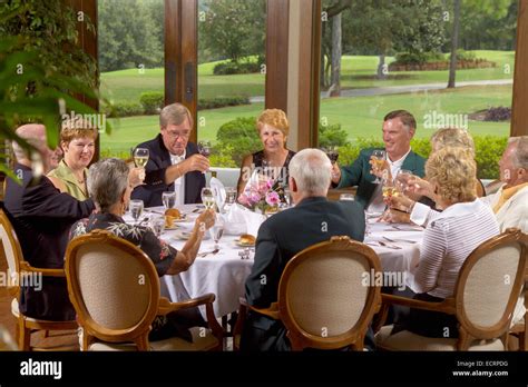 Group Of Senior Citizens Dining At Country Club Stock Photo Alamy