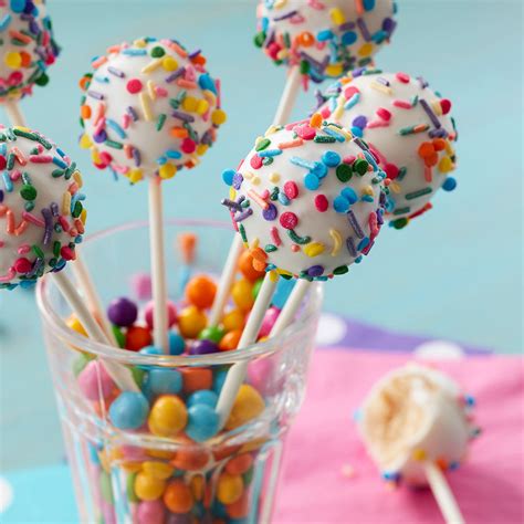 After dipping the bottom in chocolate, insert your stick. Cake Pops Recipe - Homemade Cake Pops | Wilton
