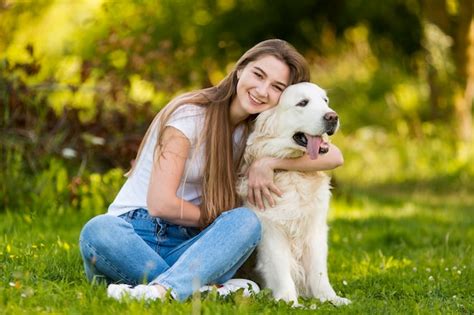 Premium Photo Young Woman Hugging Her Dog