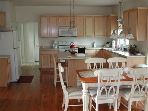 Consider tinting the primer to match the final color. Kitchen Light Stain Wood Cabinets and White Appliances - Traditional - Kitchen - new york - by ...