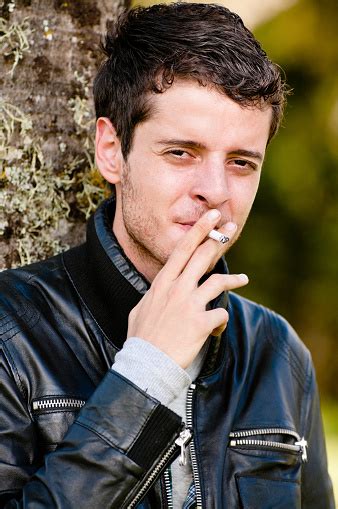 Young Man Smoking Stock Photo Download Image Now Cigarette