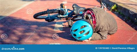 Boy Touching His Head After Falling Off To Bicycle Stock Image Image