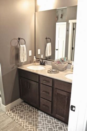 With the herringbone placement of the subway tile, this space is anything but ordinary. Popular Bathroom Paint Colors - Painted Furniture Ideas
