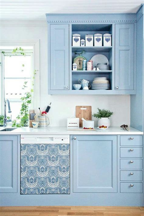 It blends so beautifully with those moody cabinets. Sky Blue Kitchen Design Ideas | InteriorHolic.com