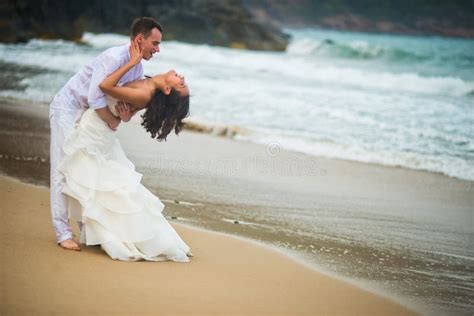 Groom Lifted The Bride Which Spread Hand In Hand Couple In Love On A