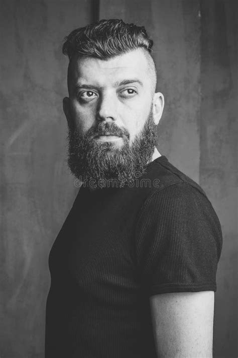 Serious Hooded Guy With Beard Sunny Outdoor On Blurred Background Man