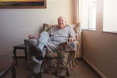 Relaxed Elderly Man Sitting On A Arm Chair Man Sitting Armchair